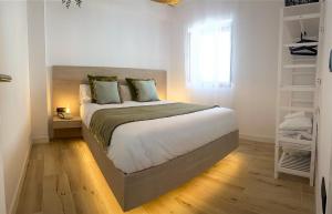 a bedroom with a large bed and a window at Boutique Casa Caldereros in Córdoba +39 photos