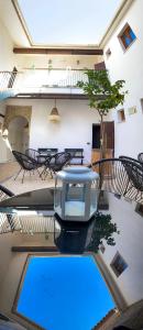 an overhead view of a pool in a building at Boutique Casa Caldereros in Córdoba