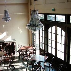a dining room with tables and chairs and chandeliers at Hotel Miyoshino Annex in Sano