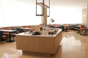 En restaurang eller annat matställe på Hanting Premium Hotel Turpan Cathay Pacific Minsheng Square