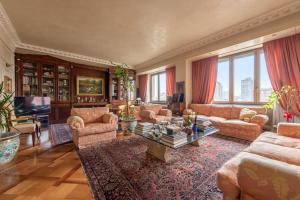 a large living room with couches and a table at centro extra luxory apartment with terrace in Milan