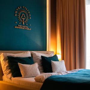 Postel nebo postele na pokoji v ubytování The Hotel Unforgettable - Hotel Tiliana by Homoky Hotels & Spa