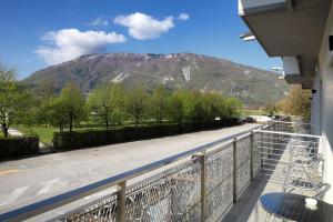 a balcony with a view of a mountain at Albergo alla spiaggia in Farra dʼAlpago