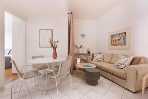 a living room with a couch and a table at Zampeli Apartment in Corfu