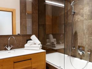 a bathroom with a shower and a sink at top Apartment on the Arlberg with sauna in Schröcken