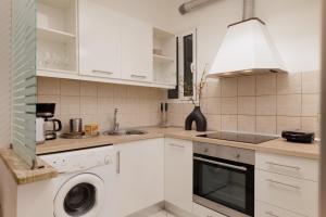 Kuchyň nebo kuchyňský kout v ubytování Zampeli Apartment