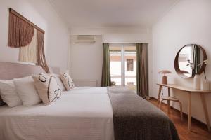 Postel nebo postele na pokoji v ubytování Zampeli Apartment