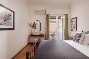 Postel nebo postele na pokoji v ubytování Zampeli Apartment