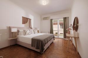 Postel nebo postele na pokoji v ubytování Zampeli Apartment