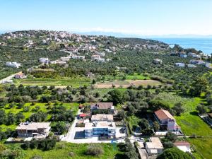 an aerial view of a house on a hill at Margo Cozy Houses in Mavrovouni