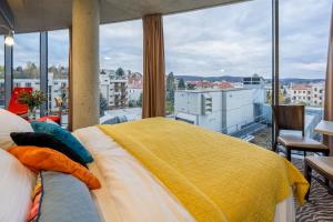 Tempat tidur dalam kamar di SONO hotel