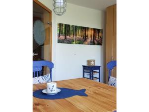 a table with a cup of coffee on top of it at Apartment in Rieseby in Rieseby