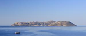 a boat in the middle of a large body of water at Hotel Sonne - Adults Only in Kaş