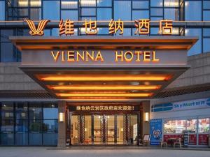 a sign for a venna hotel on the front of a building at Vienna Hotel Guiyang Yunyan District Government in Guiyang