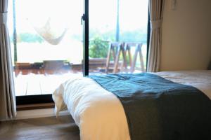 Letto o letti in una camera di 【KUON クオンSea & BBQ】愛犬同伴OK BBQが出来る一棟貸切宿