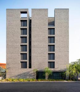 a tall brick building with a large building at Namu Hotel in Seoul