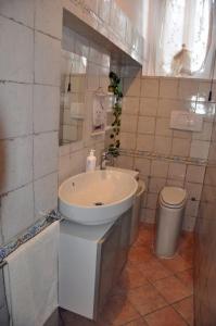 a bathroom with a sink and a toilet at Casa Soprani - Relax Marchigiano in Castelfidardo