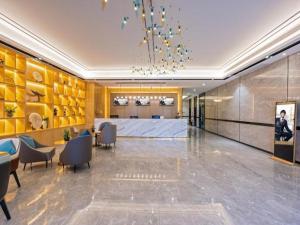a lobby with a conference room with a table and chairs at Green Tree Inn Zhuhai International Airport Huafa Shangdu in Baigaonongchang