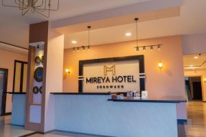 a lobby of a marmite hotel with a sign at Hotel Mireya Sorowako in Saroako