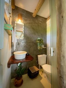 a bathroom with a sink and a toilet at ASAS DEL MAR - SUITES in Canoa Quebrada