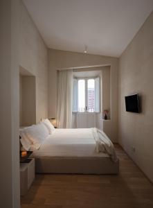 a bedroom with a large bed and a window at P10 DESIGN in Rome