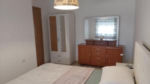 Łóżko lub łóżka w pokoju w obiekcie Apartment Modrić Zadar