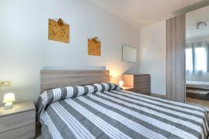 Un pat sau paturi într-o cameră la Appartamento Maria