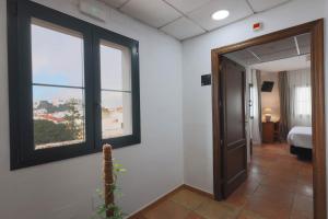 Postel nebo postele na pokoji v ubytování Hotel Tugasa Sierra y Cal