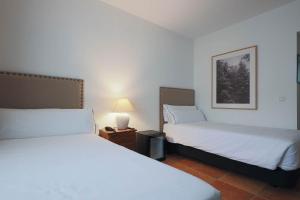 Postel nebo postele na pokoji v ubytování Hotel Tugasa Sierra y Cal