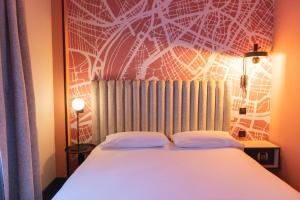 Postel nebo postele na pokoji v ubytování Le Grand Hotel