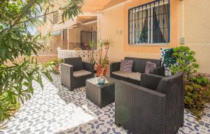 a patio with couches and chairs and plants at Urb, La Siesta in Torrevieja