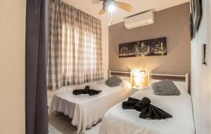 two beds in a hotel room withskirts at Urb, La Siesta in Torrevieja