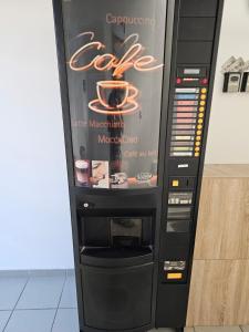 a vending machine with a drink in it at studio la poupe in Saint-Méloir-des-Ondes +9 photos
