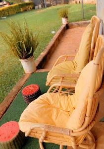 a group of chairs sitting on a deck at Runda UN Gigiri - kikao private cottage in Nairobi
