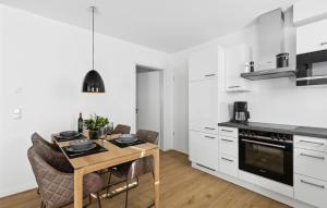 a kitchen and dining room with a table and chairs at Sonnendeck in Winterberg