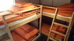 two bunk beds in a room with answersswersswersswersswersswers at Guesthouse MI CASA SU CASA in Zentsuji