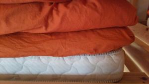 a stack of pillows on top of each other at Guesthouse MI CASA SU CASA in Zentsuji