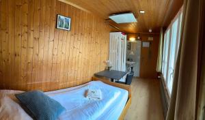 A bed or beds in a room at Hotel Hornerpub