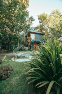 a house with a playground with a slide at Casa Antônia - Pousada Boutique in Lençóis
