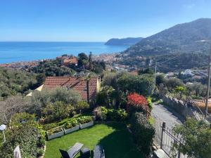 a garden with a view of the ocean at Ca Bea in Alassio