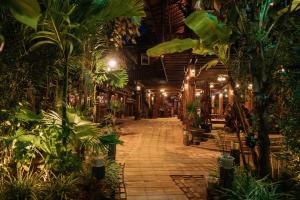 a room filled with lots of plants at Srey Krob Leak Resort in Battambang