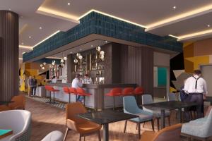 a rendering of a restaurant with tables and chairs at Maldron Hotel Liverpool City Centre in Liverpool