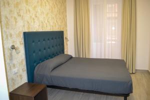 Postel nebo postele na pokoji v ubytování Nives House Roma + 13 fotografií