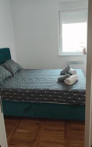 Säng eller sängar i ett rum på Apartman Comfort Beograd