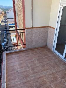 an empty balcony with a view of a city at Exclusivo Apartamento ALZIRA in Alzira