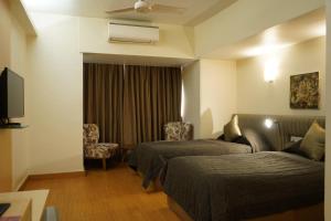 เตียงในห้องที่ Hotel Diplomat, Colaba