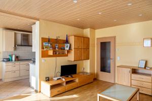 a kitchen with a desk with a computer on it at Haus Zum Rochusberg 2 in Bingen am Rhein +12 photos