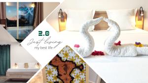 two swans sitting on top of a bed at 2 0 HÔTEL Ylang in Labattoir