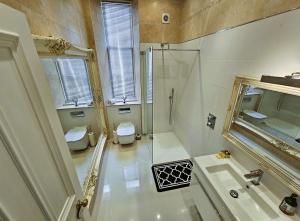 a bathroom with a shower and a toilet and a sink at Merchant's View - Luxury Seaside Designer Retreat in Rothesay