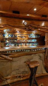 a wooden bar with a stool in front of it at Aguas del Monte Hotel SPA in San Miguel del Monte